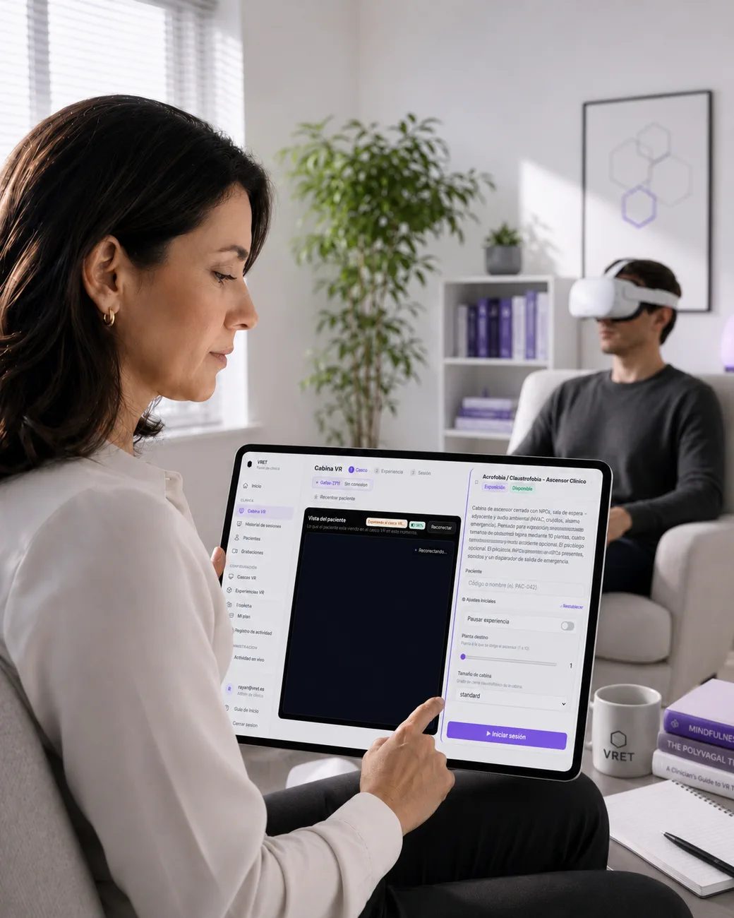 A clinician supervises a VR exposure therapy session from a tablet while the patient wears a Meta Quest headset